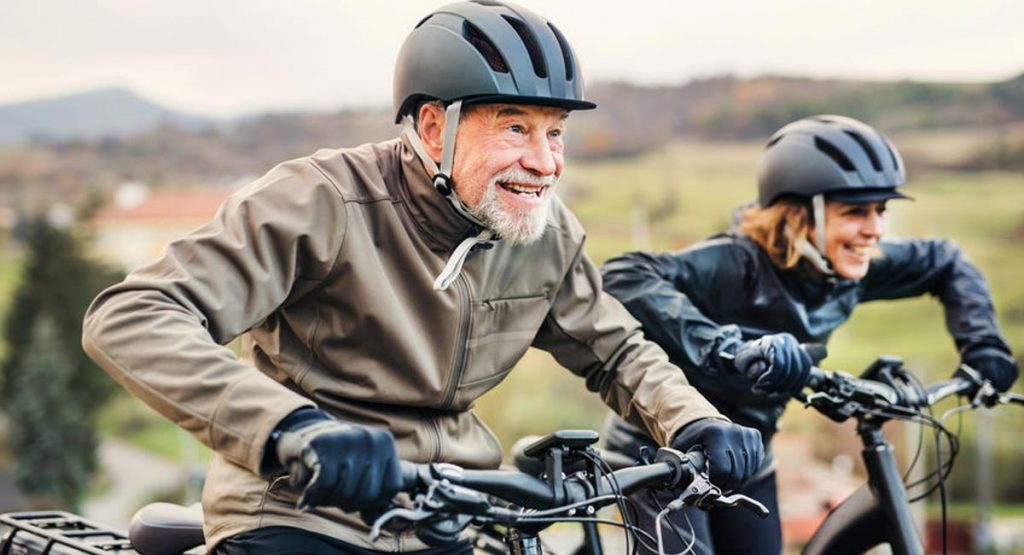 older people enjoying riding their electric bikes
