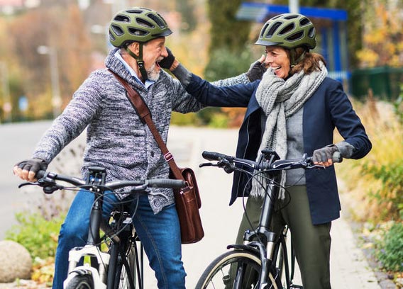 older people with ebikes meet each other